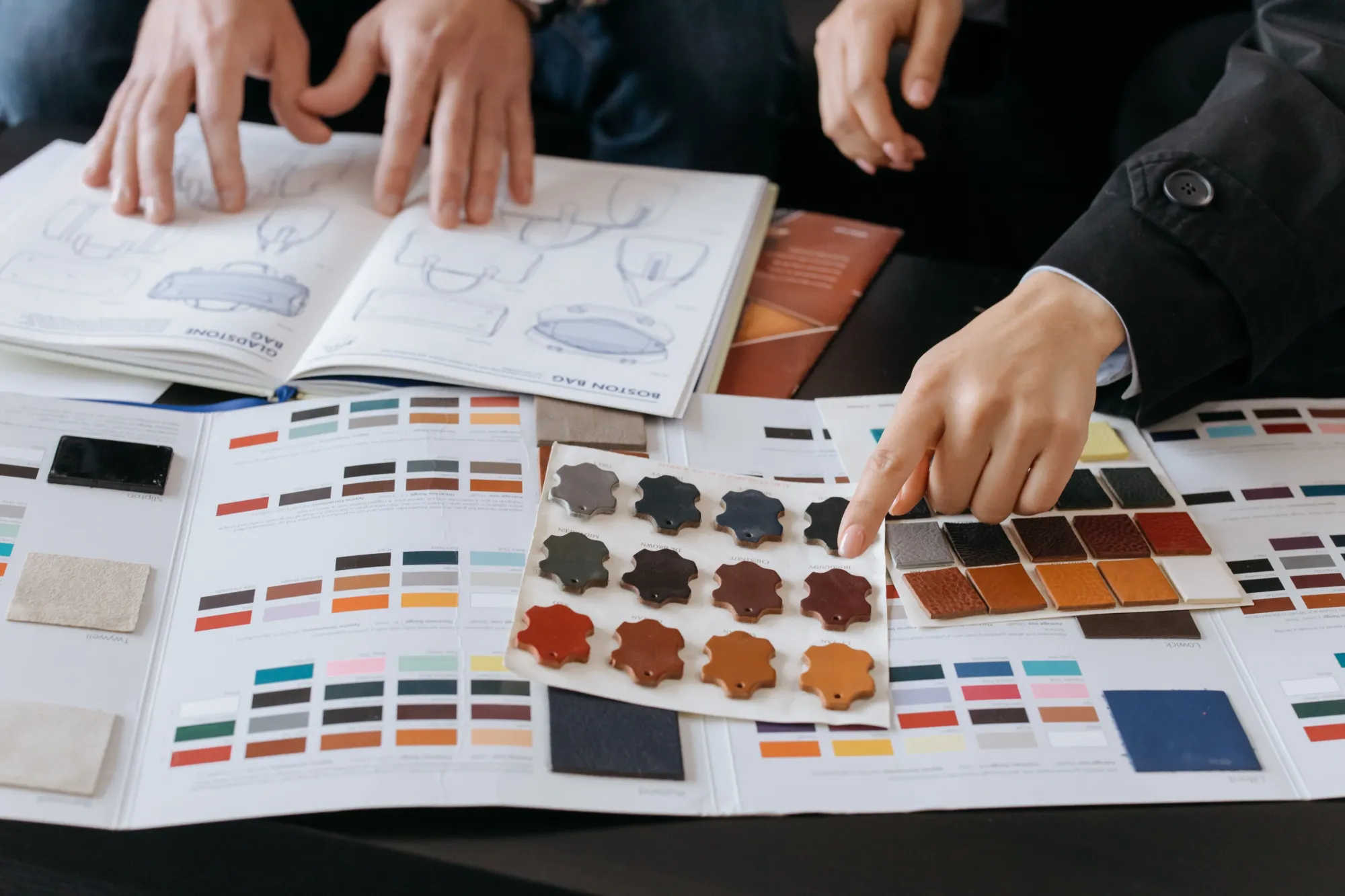 Sketches and swatch cards on the development table
