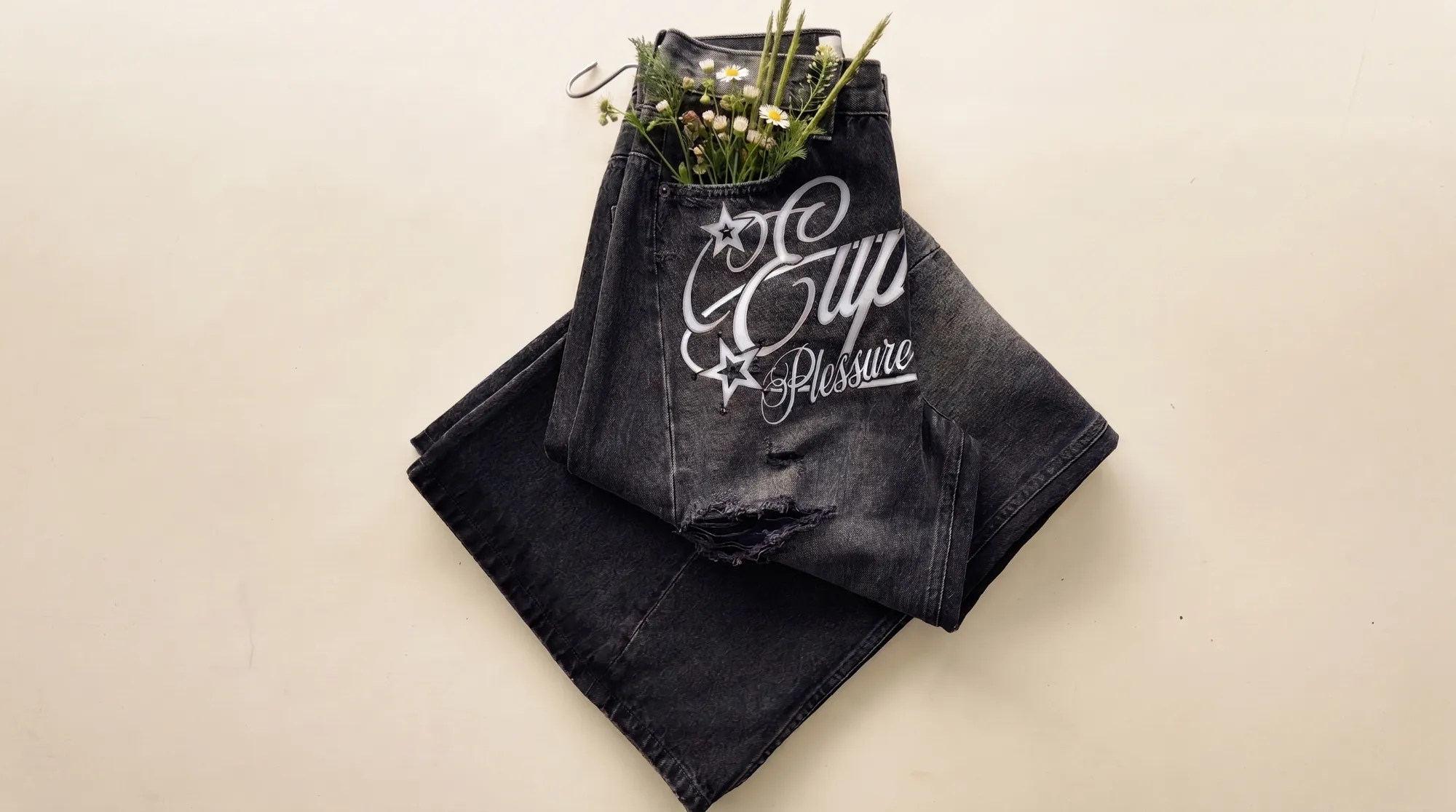Wildflowers in a denim chore-jacket pocket